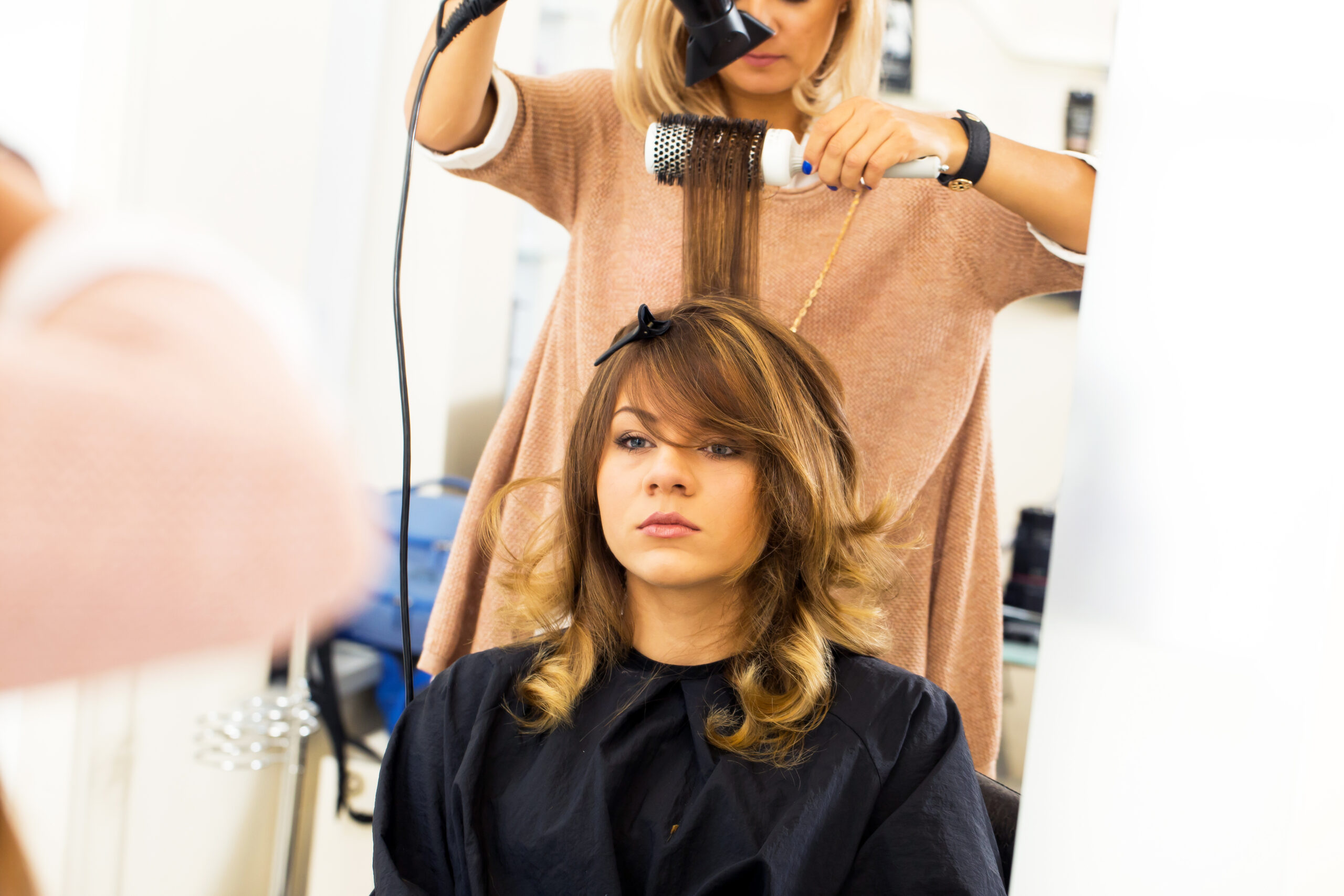 hairstylist making a client hair