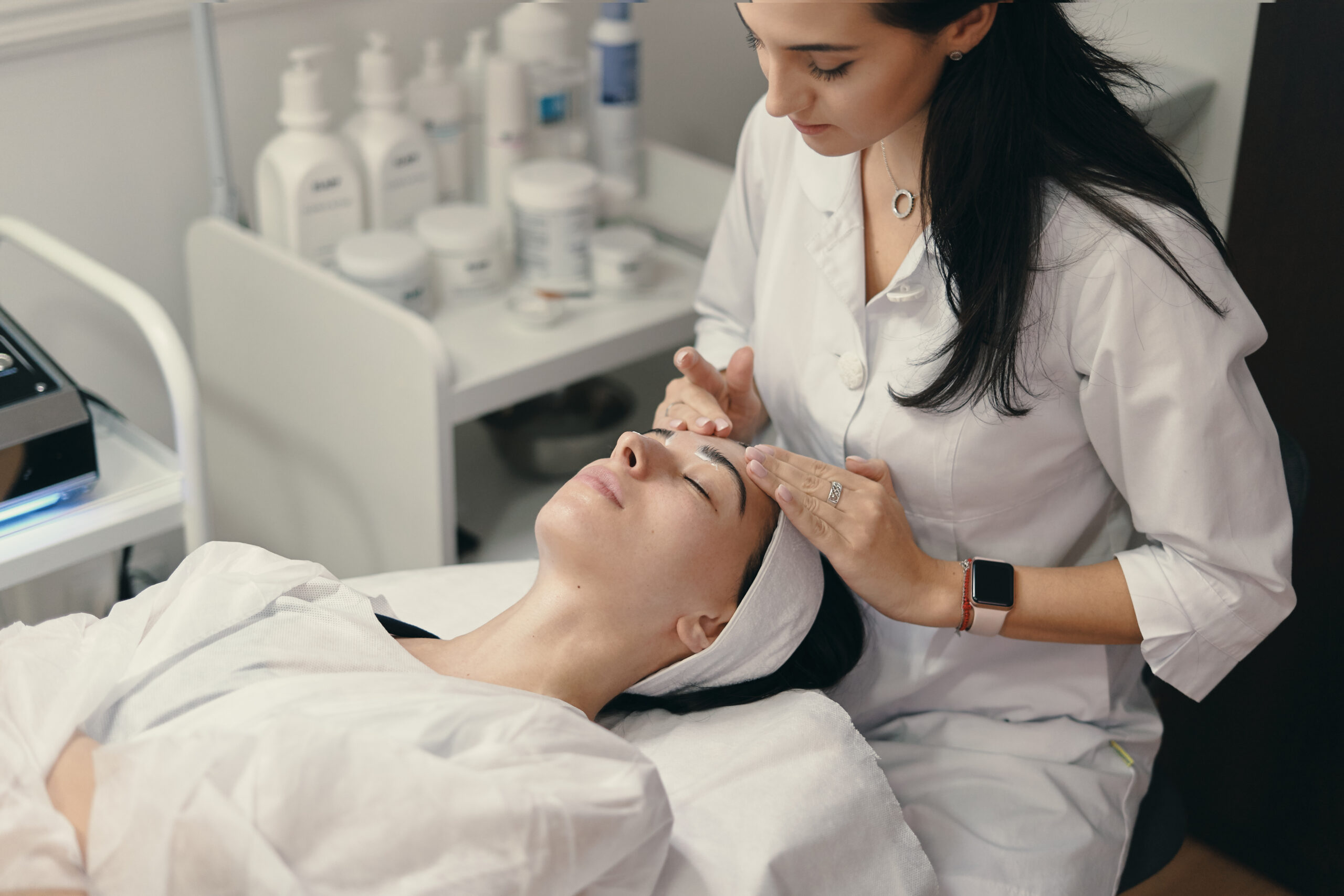 Esthetician doing skin analysis